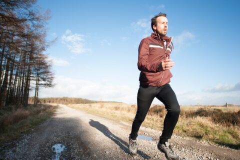 man jogging outdoors in the cold