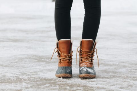 girl with boots on standing on ice