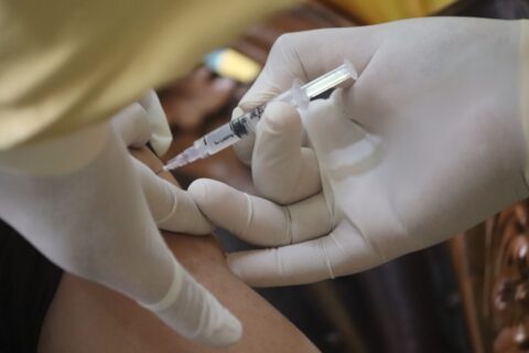 vaccine being injected into an arm